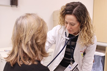 Dr. McGettigan with patient